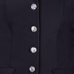 Detail sluiting wedstrijdjas QHP Elaina zwart kids